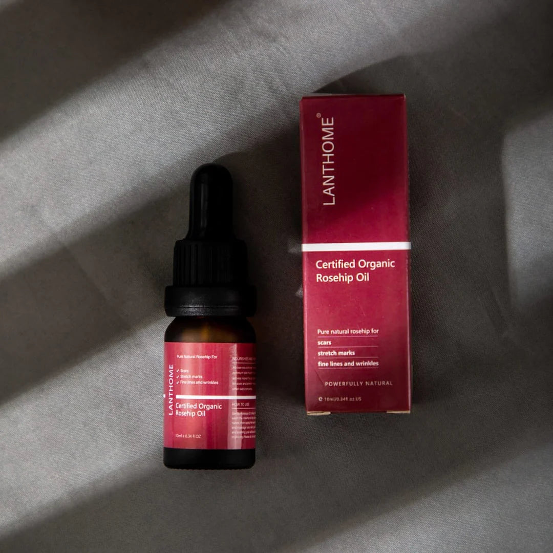 Close-up of Lanthome Rosehip Oil dropper above the bottle, featured on Rosvia.