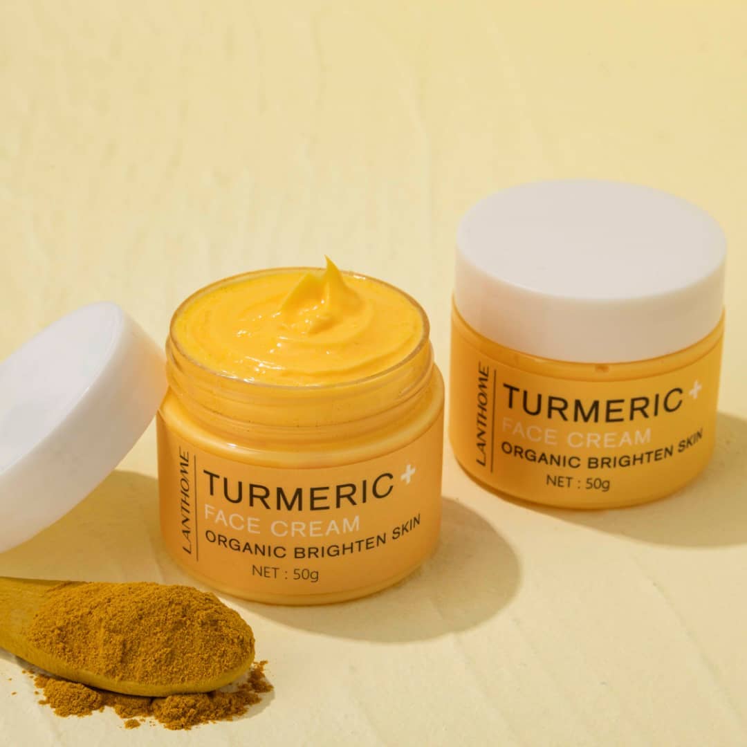 Turmeric+ Face Cream by Lanthome in an open jar, featured on Rosvia, shown with turmeric powder on a wooden spoon.